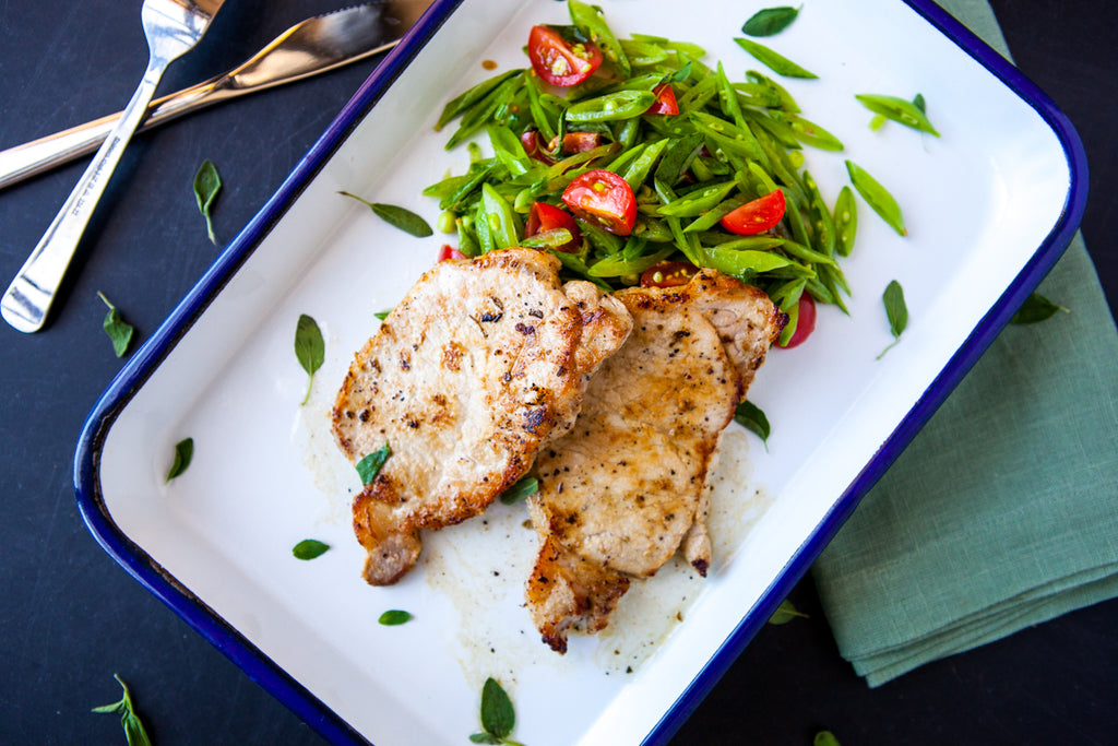 Seared Pork Chops with Snap Pea & Tomato Slaw